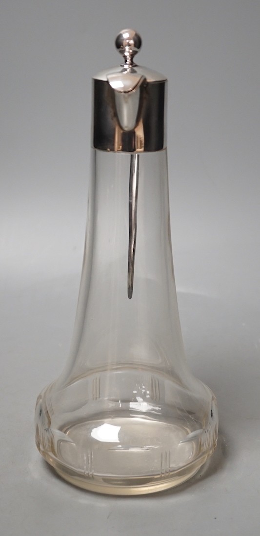 A German white metal mounted glass liqueur jug, 24.6cm.